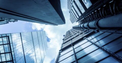 view of buildings from the bottom looking up